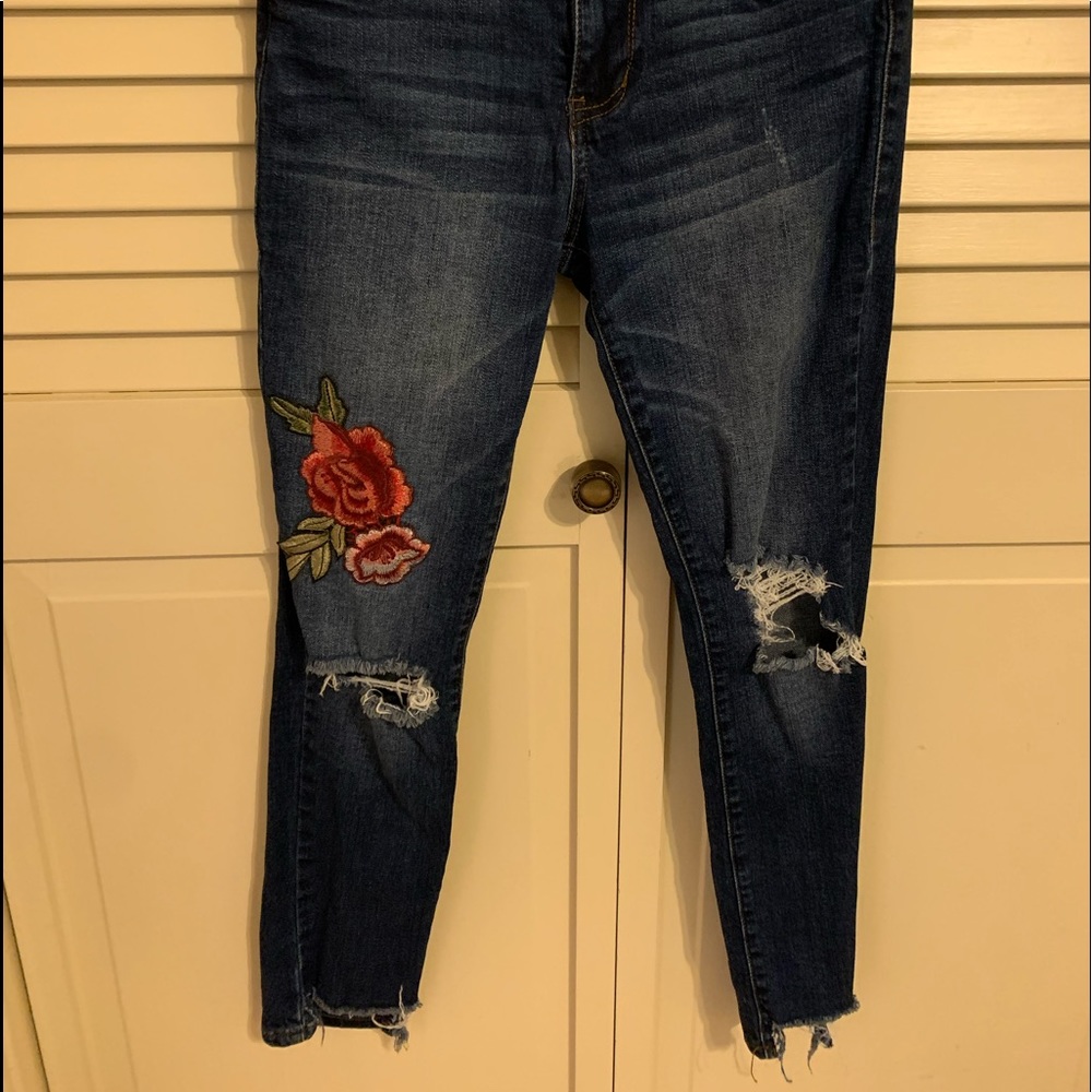 Floral patch jeans with